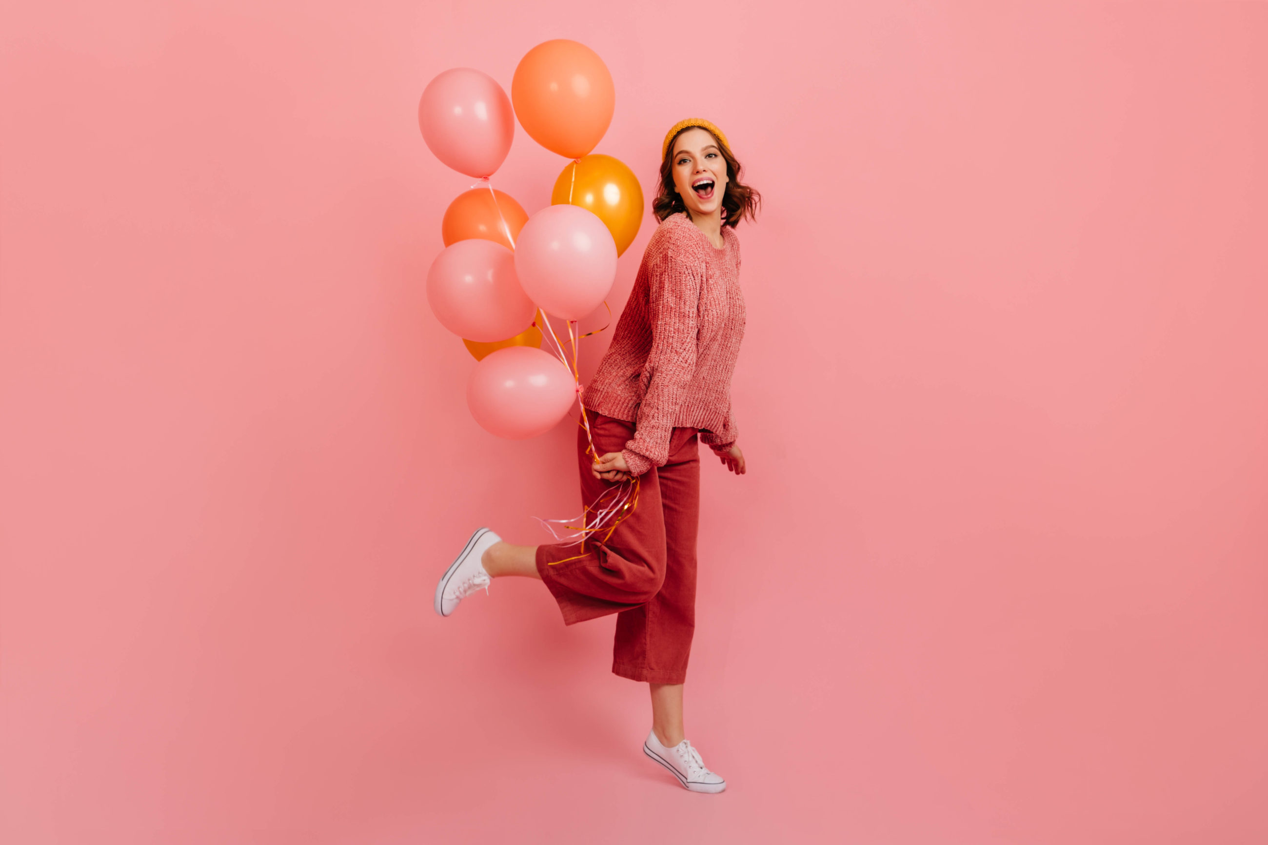 Girl holding balloons